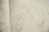 Angled view of the 1875 Woburn atlas with landowner names on Dow and Reed Streets.