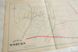Antique 1875 Woburn map plate with a center atlas fold, shown from an angle.