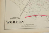 Period typography for the title 'Woburn' and map scale on the antique atlas plate.
