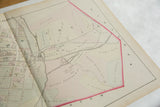 Angled close-up of the 1875 Woburn map showing Stoneham and various landowner plots.
