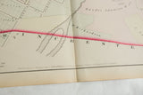 The 1875 publisher's imprint and fold detail on the antique Woburn atlas map paper.