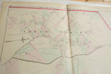 Angled detail of the 1875 Woburn map showing landowners and color-coded property lines.