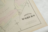 Shadowed title typography and scale details on the antique Woburn, MA atlas plate.
