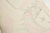 Angled view of the 1875 Woburn map showing the Middlesex Canal and pastel property plots.
