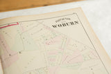 The title block and hand-colored landowner plots on the antique 1875 Woburn atlas plate.