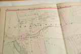 Close-up of the antique Woburn atlas map showing the central crease over the Cummingsville neighborhood.