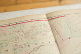 Center binding of the antique Woburn atlas showing Plate N and hand-colored landowner plots.