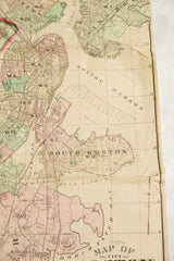 Detail of an antique 1874 Boston map showing the city center, South Boston, and the harbor.