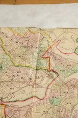Intricate engraving and hand-colored borders on the 1874 antique map of Boston.