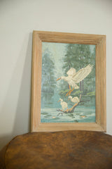 Vintage paint by numbers painting of white ducks in a blue swamp scene.