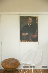 19th Century Portrait Painting of a Man in dark suit, with visible paint loss.