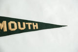 Close-up of sewn tan letters 