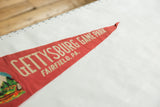 Vintage Gettysburg Game Park red felt pennant tip, displaying cream text and slight fraying.