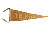 Antique Texas felt flag pennant, mustard yellow with stitched 'TEXAS' letters, 6x16 inches.