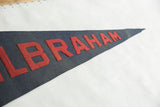 Vintage Wilbraham Academy pennant with red block letters on textured blue felt.