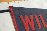 Antique Wilbraham Academy felt pennant, blue tie loop, red sewn letters and visible pinholes.