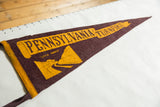 Vintage Pennsylvania Turnpike felt pennant, yellow highway graphic on textured wine red.