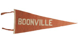Antique Boonville felt flag pennant in time-softened orange wool with sewn white block letters.