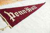 Close perspective on the sewn white lettering of the antique maroon Penn Hall felt flag.