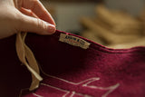 Detail of the original Annin & Co. Flag Makers tag on the antique maroon felt.