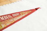 Tapered end of the vintage red felt pennant with aged graphic detail.