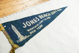 Worn blue felt Jones Beach State Park pennant, showing white lighthouse design and yellow ties.
