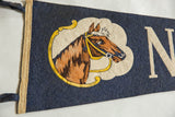 Vintage Nag's Head pennant showcasing brown horse design on blue felt, with cream letter N.