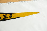 Aged yellow felt tip with black border of the Hopewell N.J. pennant.
