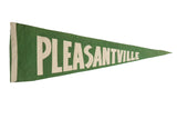 Vintage Pleasantville felt flag pennant with white block letters on green, 9x23 inches.