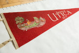 Red felt pennant with Native American canoe illustration and cream colored binding.