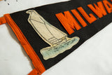 Sewn felt sailboat graphic on the vintage Milwaukee pennant with orange letters.