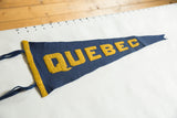 Close view of the sewn yellow felt border and blue ties on the antique Quebec pennant.