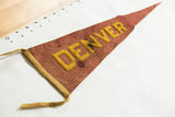 Antique red felt Denver pennant with yellow applique letters and aged tie string.