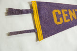 Purple felt hanging ties and stitched gold border of a vintage Central pennant.