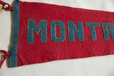 Red felt Montreal pennant showing blue stitched 'MONT' letters and tied blue binding.