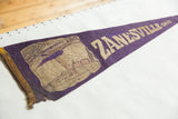 Aged purple felt pennant with Zanesville Y Bridge illustration, lettering, and yellow binding.
