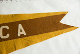 Pointed swallowtail tip of the antique felt pennant, showing brown and yellow felt, stitched edges.
