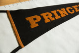 Orange felt letters 'PR' and sewn edge binding on vintage Princeton pennant.