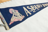 Vintage Asbury Park felt pennant with woman, ASBURY text, and creased blue felt.