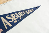 Angled view of the vintage Asbury Park N.J. felt pennant tip, showing blue and cream text with textured folds.