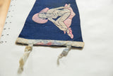 Detail of the vintage Asbury Park felt pennant's lower white border and frayed ties.