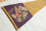 Detailed view of the vintage 'Surf Bathing' graphic on the purple wool felt pennant.