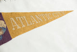 Close-up showing the wool felt texture and lettering on the antique Atlantic City pennant.