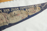 Blue felt Mission San Juan Capistrano pennant with faded Old Chapel Arches illustration.