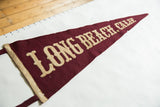 Antique Long Beach, Calif. felt pennant showing textured burgundy wool and aged beige applique letters.