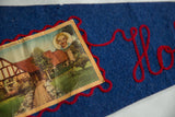 Vintage blue felt pennant showing Bette Davis house postcard, red embroidered 'Holly'.