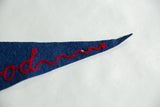 Vintage blue felt Hollywood pennant's tapered tip with red cursive embroidery and a hole.