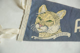White sewn edge and tie strings on a vintage blue felt pennant.