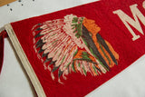 Printed Native American figure and intricate feathered headdress on red felt pennant.