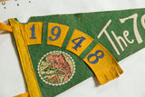 Vintage 1948 The 7 Caves felt pennant detail, showing yellow numbers, green background, and aged felt texture.